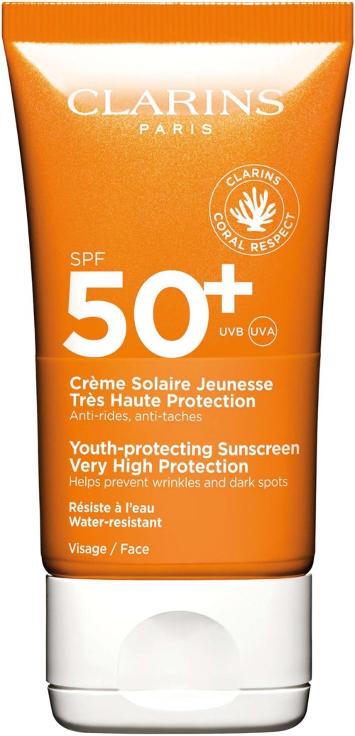 Orange sunscreen tube with SPF 50+. It has text in French and English about high protection and water resistance.