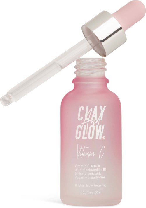 Różowa butelka z napisem 'Clay Day Glow' serum witaminy C z pipetą na niej.