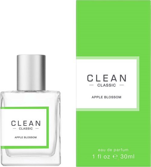 Een parfumfles en doos met 'CLEAN Classic Apple Blossom', in groen en wit.