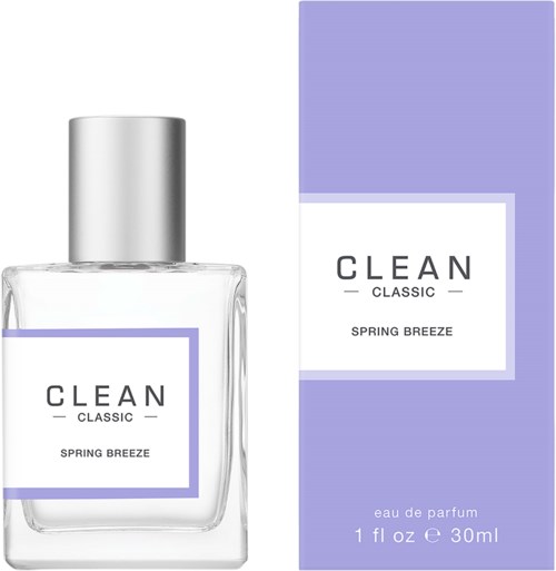 Een parfumfles en doos genaamd 'CLEAN CLASSIC SPRING BREEZE' met paarse en witte kleuren en een zilveren dop.