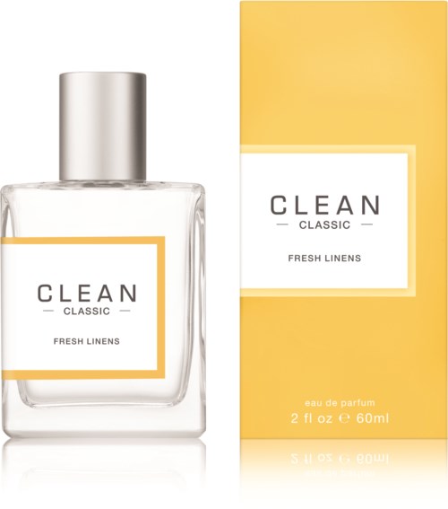 Een helder parfumflesje en een gele doos met label voor 'CLEAN Classic' met frisse linnengeur.
