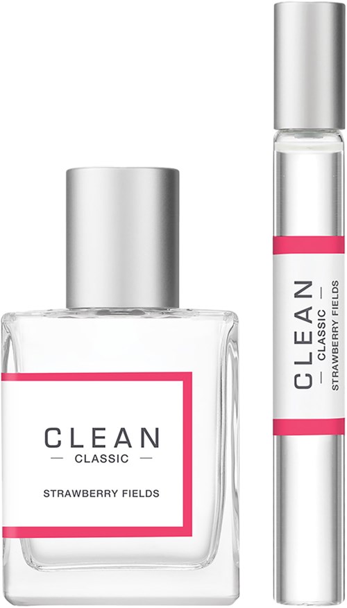 Twee flessen met roze labels, één groot en één klein, met 'CLEAN CLASSIC STRAWBERRY FIELDS'.