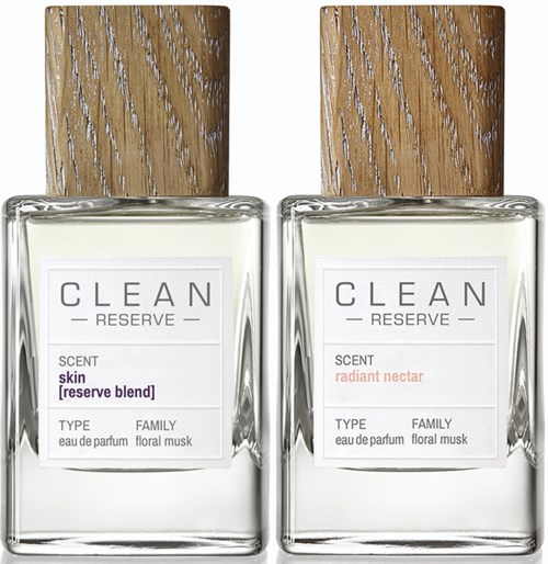 Twee parfumflesjes met houten deksels, één met label "reserve blend" voor huidgeur, andere "radiant nectar."