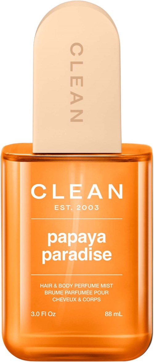 Ein leuchtend orange Behälter mit beigem Sprühkopf, beschriftet Clean Papaya Paradise Haar- und Körperspray.