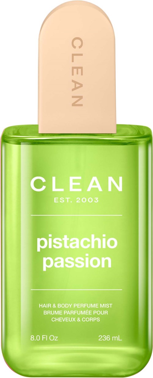 Vihreä suihkepullo nimeltä Clean Pistachio Passion, beige korkki ja selkeä teksti, sisältää hiusten ja kehon tuoksun.