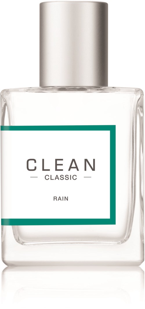 Een helder glazen fles met een zilveren dop, gemarkeerd "CLEAN CLASSIC RAIN" en een turkise rand.