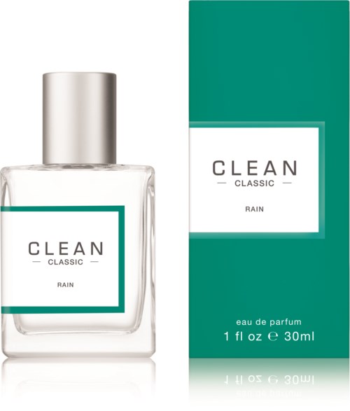 Een heldere parfumfles met een zilveren dop en een groene doos. Het label zegt "CLEAN CLASSIC RAIN" en "eau de parfum."