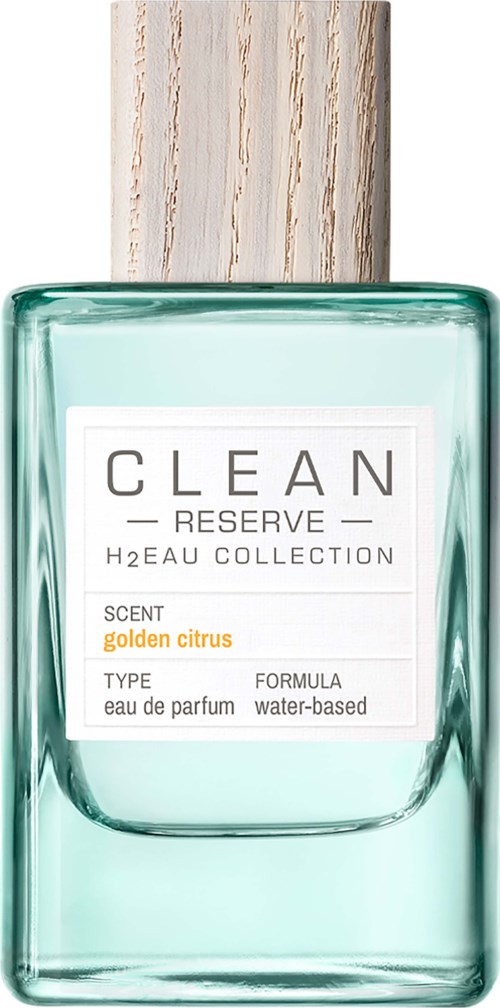 Een glazen fles met houten dop, gemarkeerd 'CLEAN RESERVE' en heeft een lichtgroene tint. Het vermeldt 'gouden citrus' geur.