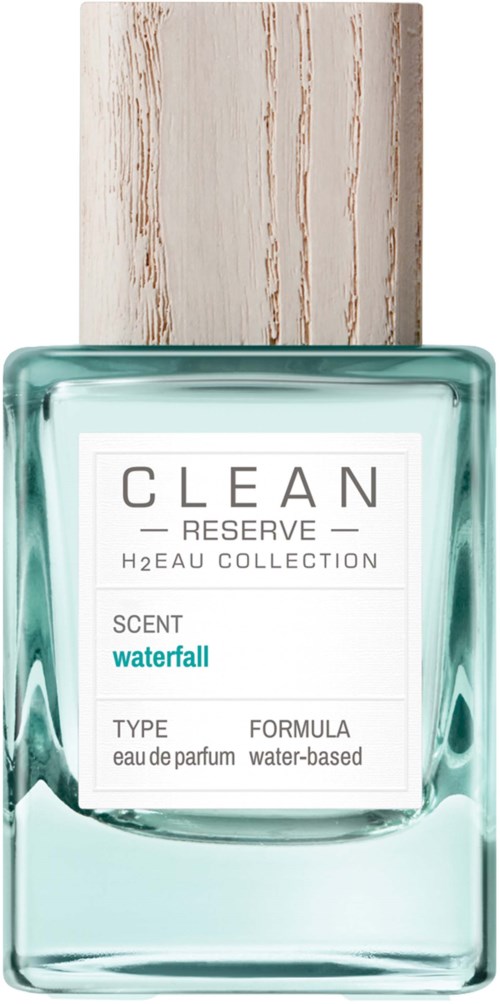 A clear perfume bottle with a wood-like cap, labeled 'CLEAN Reserve' and 'Waterfall' scent.