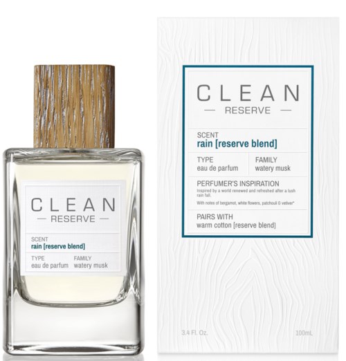 Een parfumfles met een houten dop en een witte doos, beide gelabeld "CLEAN RESERVE" met geur- en typegegevens.