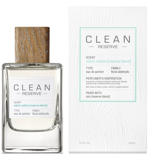 Een parfumfles met houten dop, label toont geur als warme katoen, met bloemige en aldehyde noten.