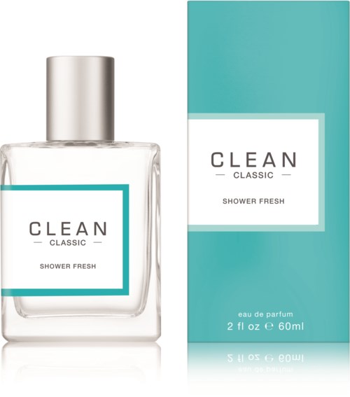 Een doorzichtige parfumfles met zilveren dop naast een turquoise doos met 'CLEAN Classic Shower Fresh'.