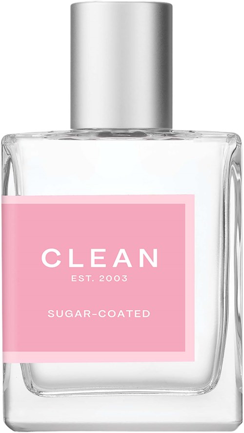 A clear glass bottle with a silver cap, pink label says "CLEAN," adds "EST. 2003," and "SUGAR-COATED."