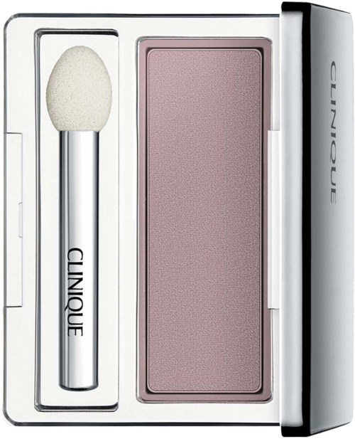 A makeup set including a sponge, a pink blush, and a compact case with the Clinique logo.