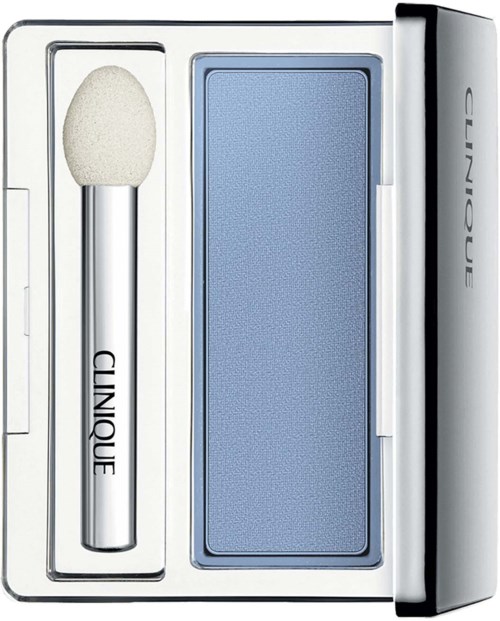 Een huidverzorgingsset met spons, blauwe applicator en witte doos.