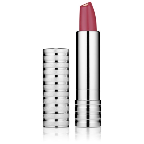 A silver lipstick tube with a pink lipstick bulb on top, standing next to a stack of similar tubes.