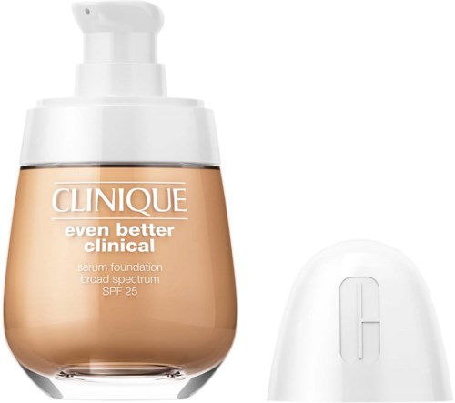 Een fles Clinique foundation met pomp en een wit apparaat ernaast.