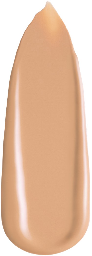 Ett dropp av beige flytande foundation med en slät, glänsande yta på svart bakgrund.