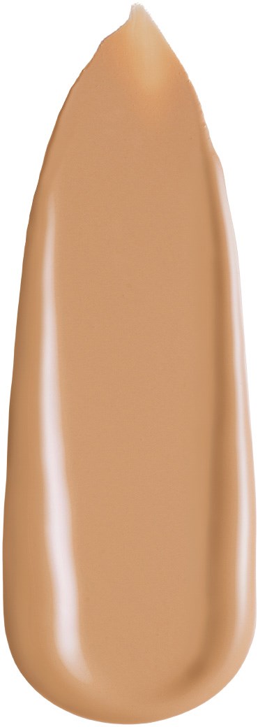 Ett beige ovalformat med spetsig ände, liknande en foundation- eller concealerprodukt.