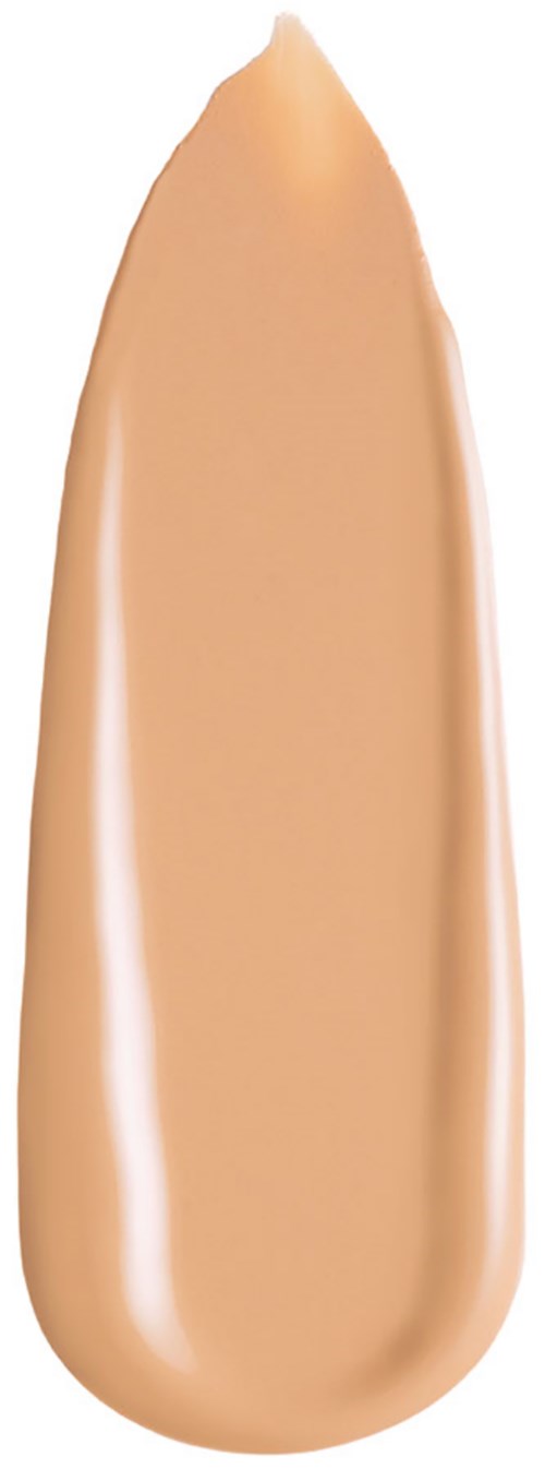 Ett beige flytande foundationdropp med en slät, rund form och glänsande yta.