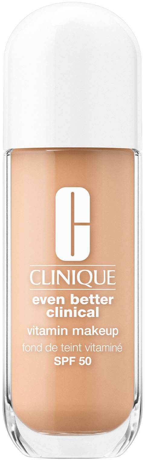 A bottle of Clinique vitamin makeup with SPF 50, beige liquid inside, white cap, and logo on front.