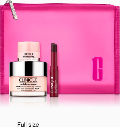 Clinique skincare set with moisturizer, eye cream, and lip gloss in front of a pink bag featuring the Clinique logo.