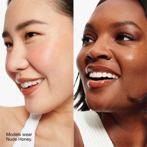 Two women smile and wear nude honey-colored makeup. One has light skin, the other dark skin.