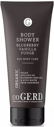 A black tube of body shower with white text, labeled 'Blueberry Vanilla Fudge' and 'Vegan, Organic, Eco.'
