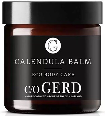 A black jar with a label that reads "Calendula Balm" and "Eco Body Care."