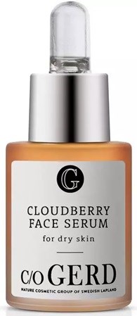 A small bottle of cloudberry face serum for dry skin with a silver cap and label.