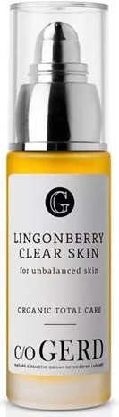 A yellow tube labeled Lingonberry Clear Skin cream for unbalanced skin, with a silver cap and logo.