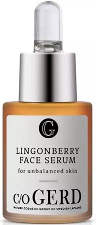 A small bottle of Lingonberry face serum with a dropper, labeled for unbalanced skin care.