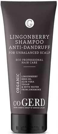 Black shampoo tube labeled for anti-dandruff, contains organic ingredients like seed oil, aloe vera, and water.