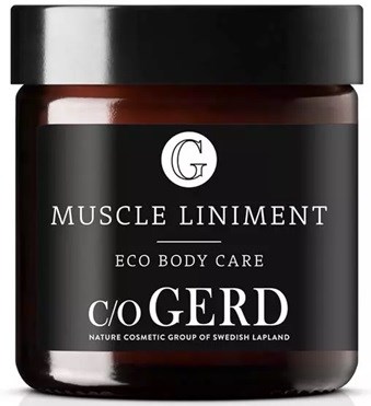 Czarny słoik z białym i srebrnym tekstem, oznaczony 'Muscle Liniment Eco Body Care' i 'c/o GERD', podkreślając grupę kosmetyków naturalnych.