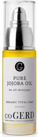 Small yellow bottle labeled 'Pure Jojoba Oil' for skin, with a black and white label, and silver cap.