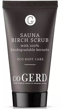 A black tube container for sauna birch scrub with white text, emphasizing biodegradable kernels and eco-friendly care.