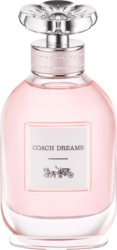 A pink perfume bottle with a silver cap, labeled Coach Dreams, featuring a horse and carriage logo.