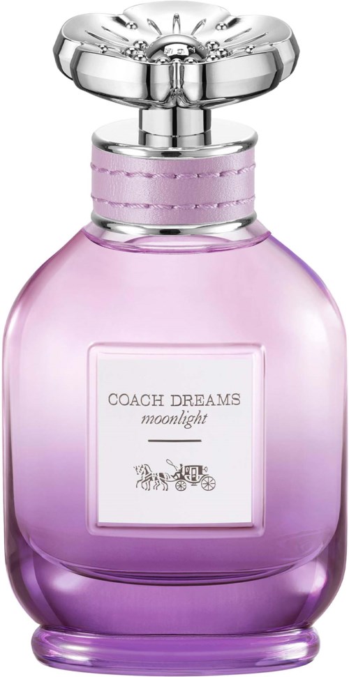 A pink perfume bottle with a silver cap and a label that says Coach Dreams Moonlight.