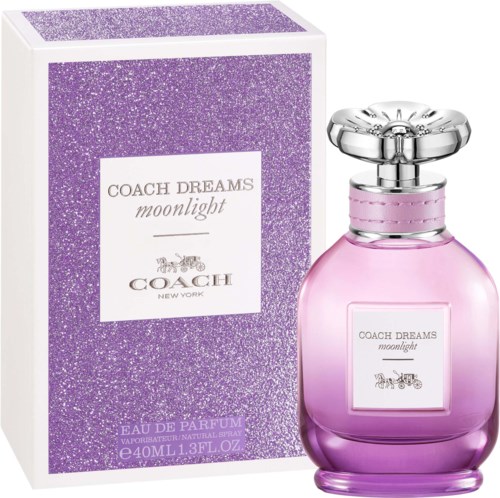 A perfume bottle and box, both pink and purple, with the words Coach Dreams moonlight and a horse-drawn carriage.