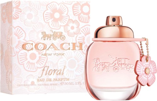 A floral perfume bottle with a pink tint, flower charm, and a matching box with floral design and logo.