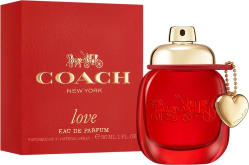 A Coach Love perfume bottle and box, red and gold colors, with a heart charm.