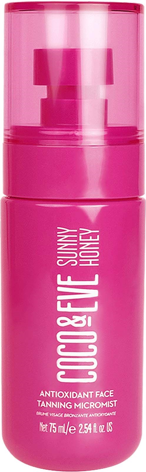 En rosa flaske med hvit tekst for Coco & Eve Sunny Honey antioxidant ansiktsbrun-aktivator.