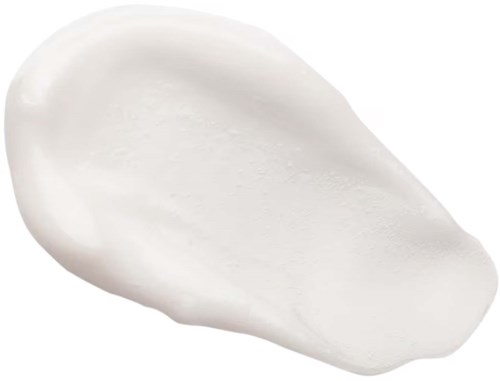 En hvit, glatt, oval form for væske eller krem på en svart bakgrunn.