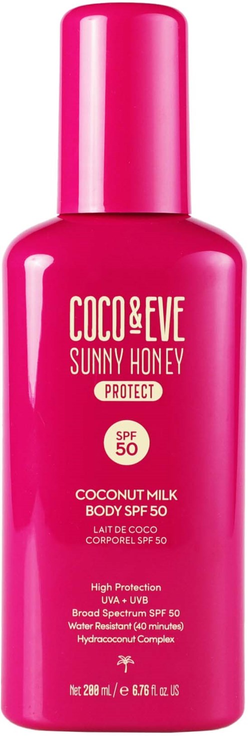 A pink bottle of Coco & Eve Sunny Honey body lotion with SPF 50 and coconut milk.