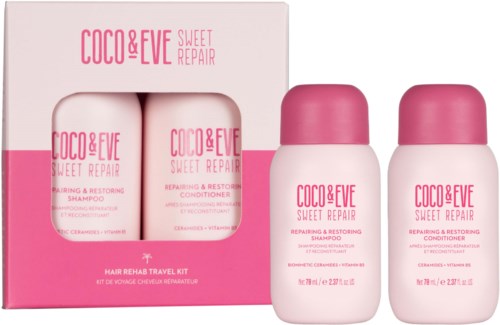 Haarreparatieset met twee kleine flessen en een doos, roze en wit ontwerp, voor het herstellen van haargeluk.