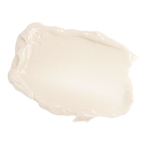 A dollop of white cream spread out on a white background.