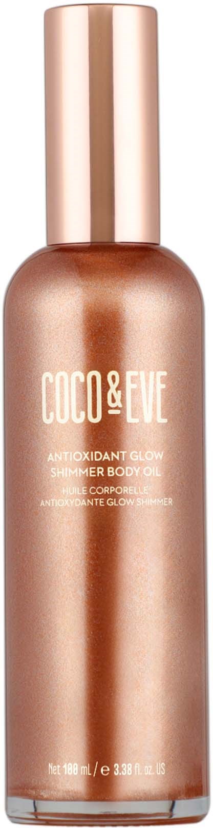 En roségull kroppsolje flaske med en skinnende gullhette, merket "COCO & EVE" og "Antioxidant Glow Summertime Body Oil."