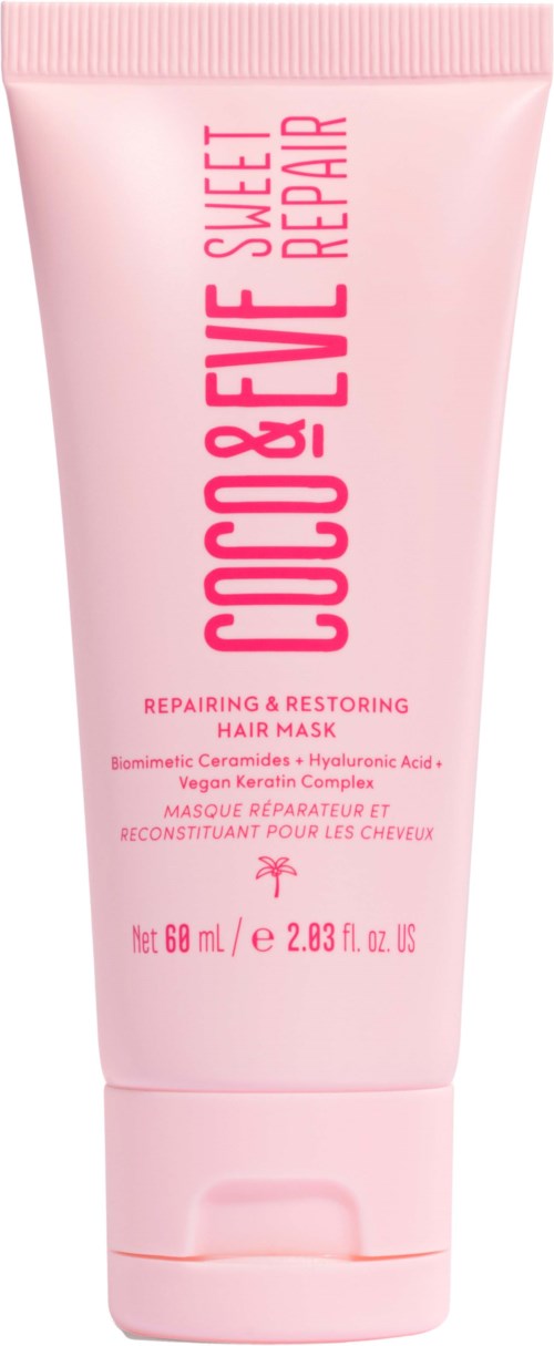 Pink hair mask tube with text about repair and restoration, net 68 mL, 2.3 fl oz. Contains coconut and vegan ingredients.