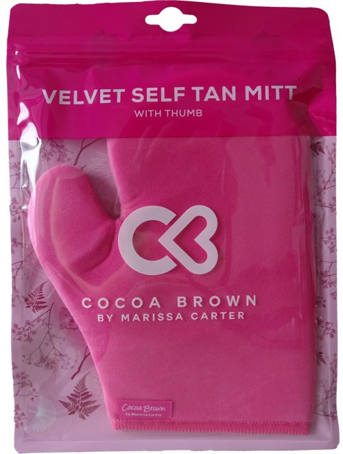 Pinkfarbener Selbstbräunungshandschuh mit Daumen, genannt 'Velvet Self Tan Mitt' von Cocoa Brown, zum Auftragen von Selbstbräuner.