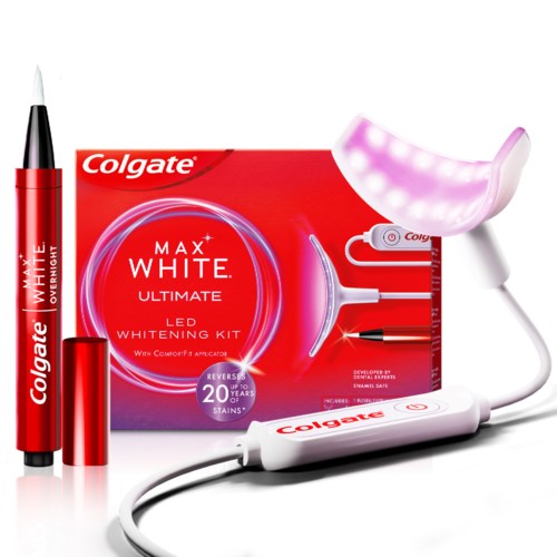 A teeth whitening kit from Colgate with LED light, mouth tray, gel pen, and instructions on packaging.